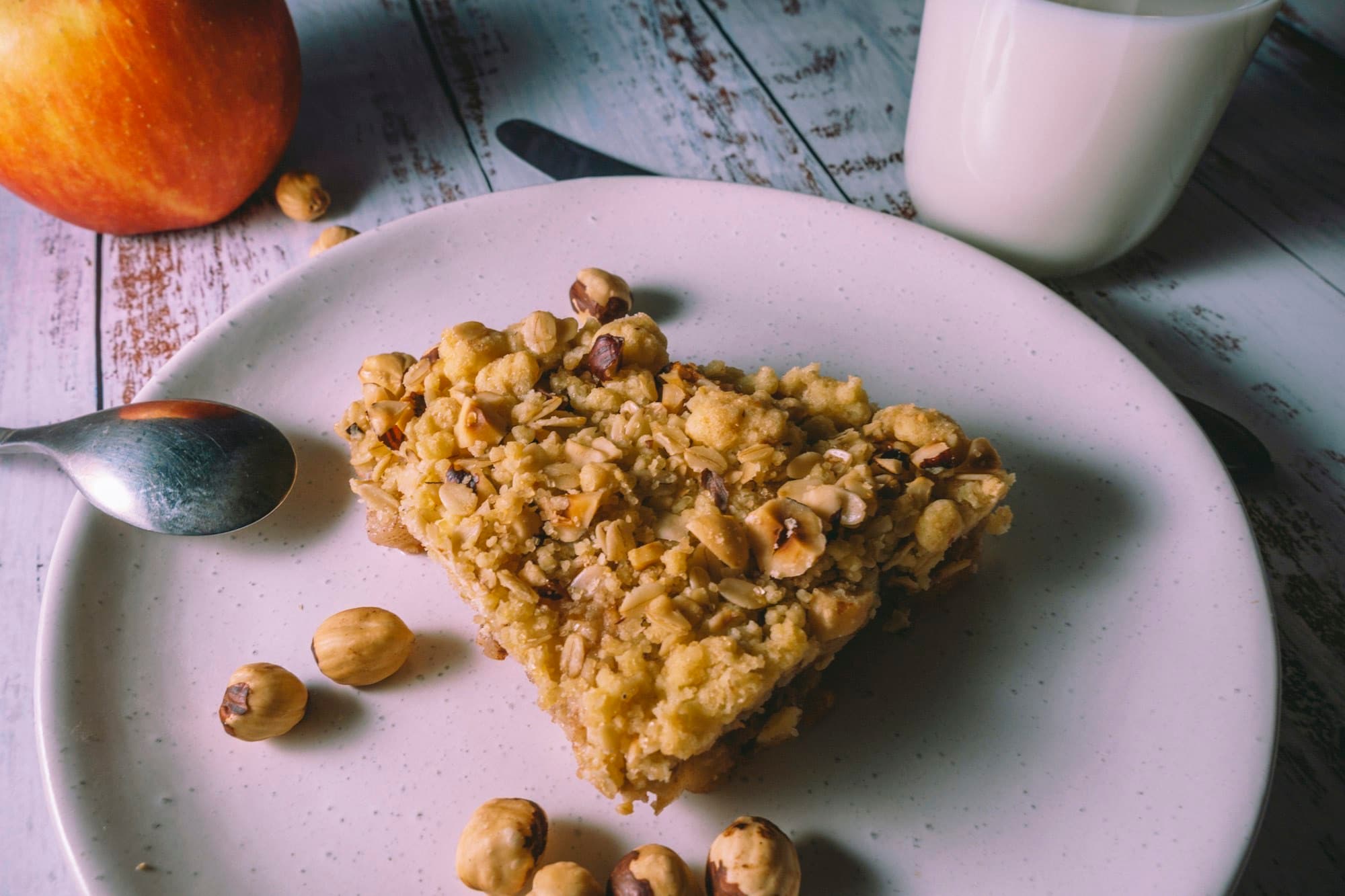 Warm apple and walnut crumble with cream