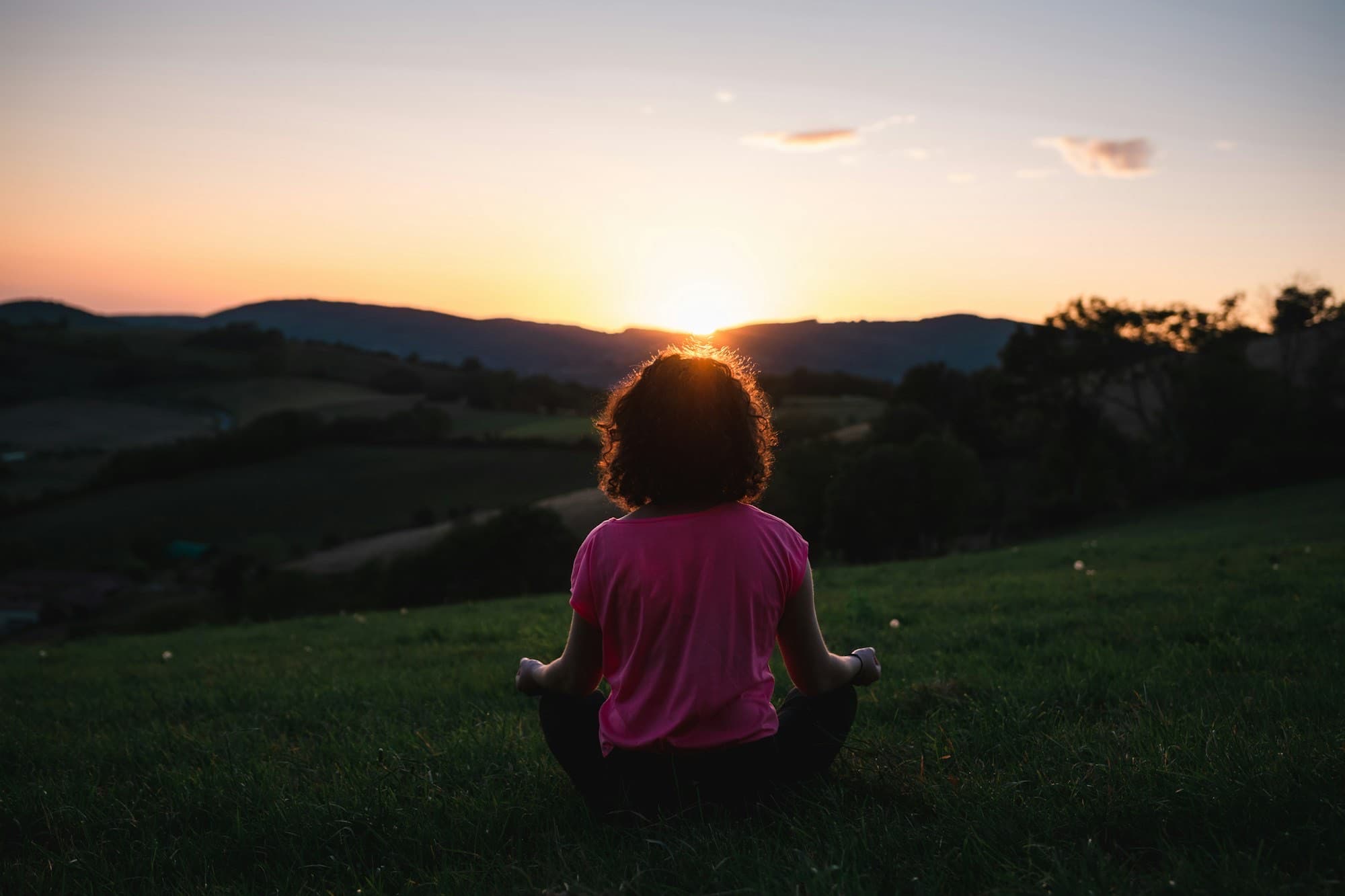 Yoga at sunrise in the mountains