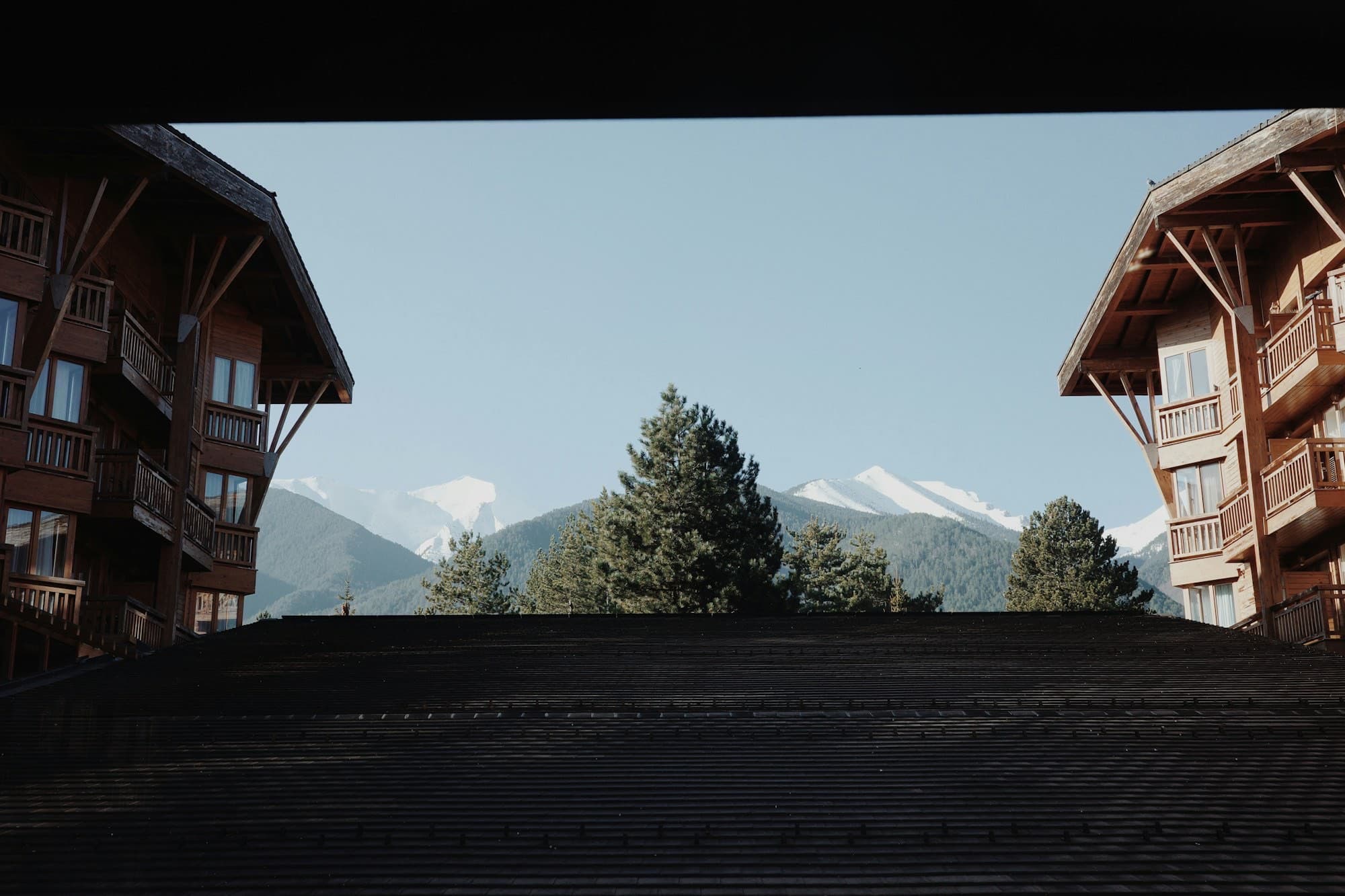 A wood-lined guest room with mountain views at Tribe Inn Sangla
